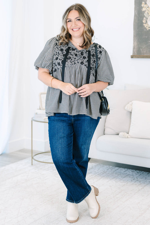Plus Size black and white gingham top with floral embroidery, puff sleeves, and black ribbon ties.
