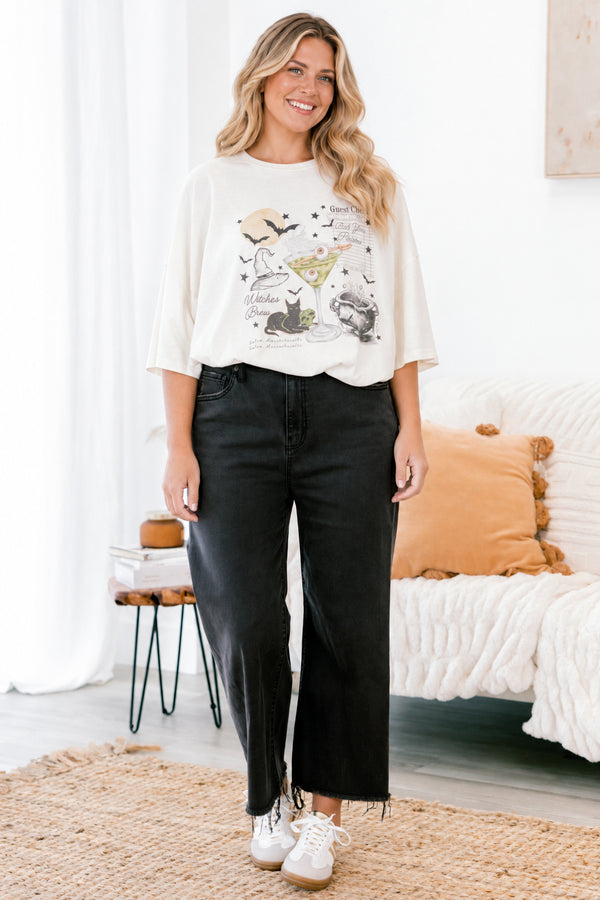 Chic Soul plus size clothing, ivory short sleeve boyfriend tee with a black cat, martini with eyeballs, bats, and other Halloween graphics on the front