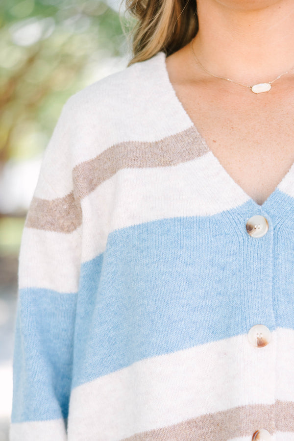 Plus Size oversized v-neck cardigan with brown and blue horizontal stripes and button-down front.