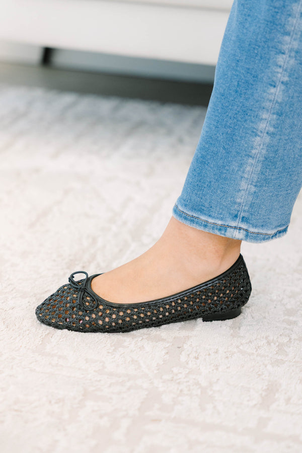 Plus Size black woven mesh ballet flats with a small bow detail paired with blue denim jeans.