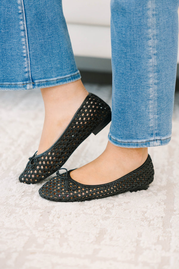 Plus Size black woven mesh ballet flats with a small bow detail paired with blue denim jeans.