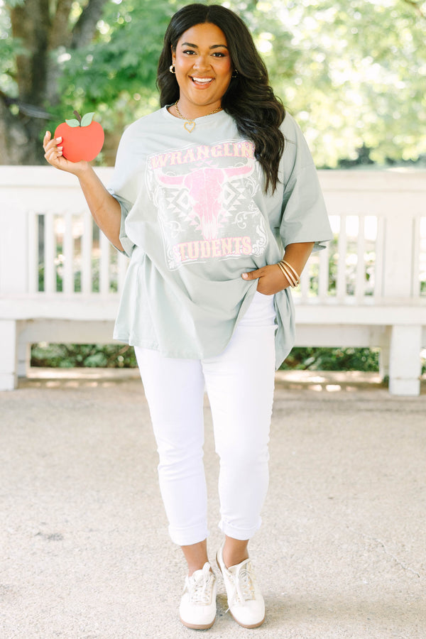 Plus size light sage boyfriend tee with a pink western bull skull graphic and flowy oversized fit.