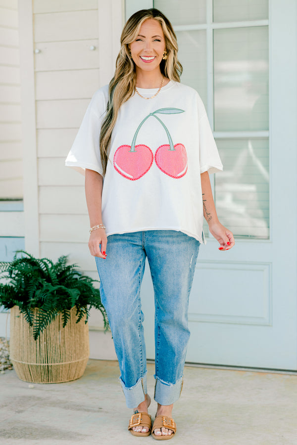 Plus Size white short sleeve top with red gingham embroidered cherry design and side slits.