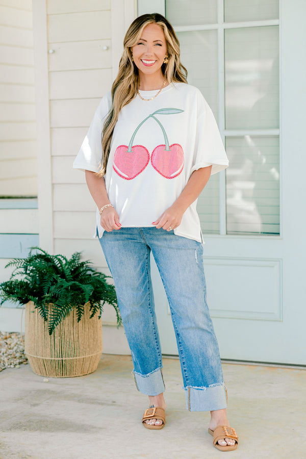 Plus Size white short sleeve top with red gingham embroidered cherry design and side slits.