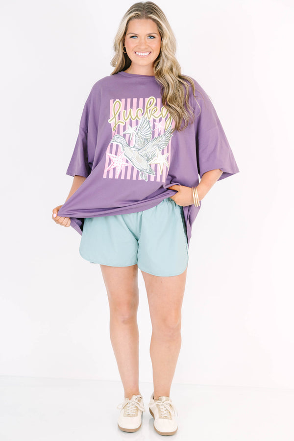 Plus Size lilac grey boyfriend tee with a lucky duck graphic paired with light blue shorts.