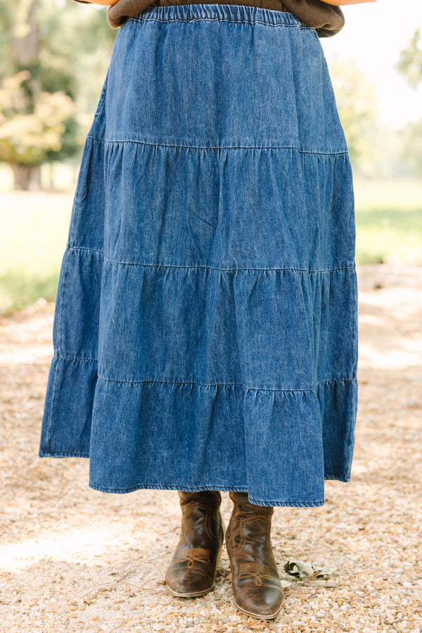 Plus size dark wash denim tiered maxi skirt with a comfortable elastic waist and flowy silhouette.