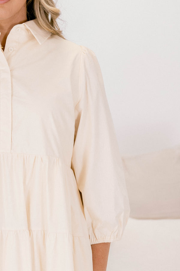 Chic Soul plus size clothing, cream long sleeve short tiered baby doll dress with buttons 1/4 of the way down and a collar