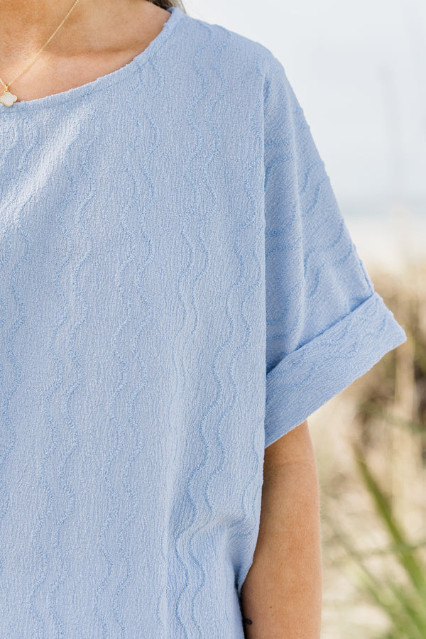 Plus Size sky blue ripple textured top with a round neckline and cuffed short sleeves.