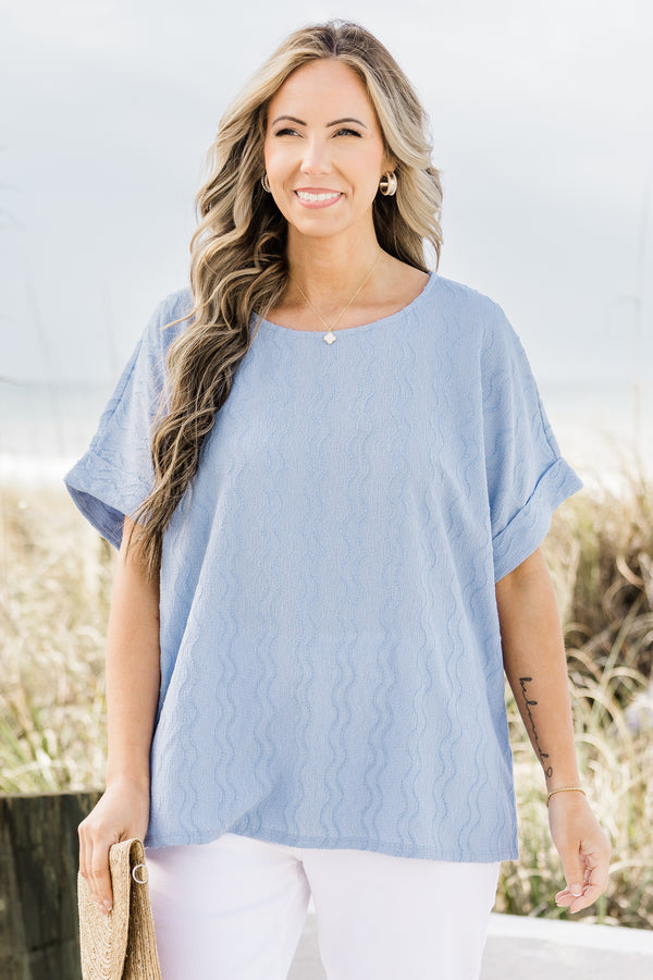 Plus Size sky blue ripple textured top with a round neckline and cuffed short sleeves.