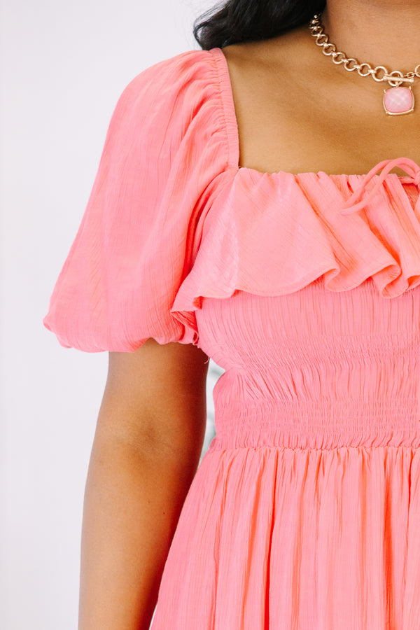 Plus Size coral midi dress with a ruffled off-the-shoulder neckline and smocked bodice.