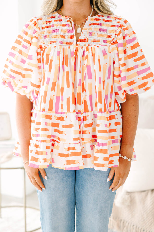 Chic Soul plus size clothing, orange abstract flowy short sleeve top with v neckline and smocked chest detail with large puff sleeves