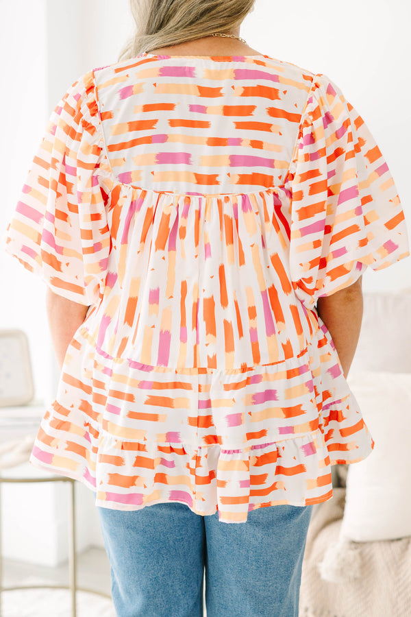 Chic Soul plus size clothing, orange abstract flowy short sleeve top with v neckline and smocked chest detail with large puff sleeves