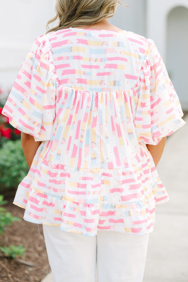 Chic Soul plus size clothing, flowy white top with multicolored abstract design with short bubble sleeves and a slight v-neckline as well as a smocked texture on the shoulder area 