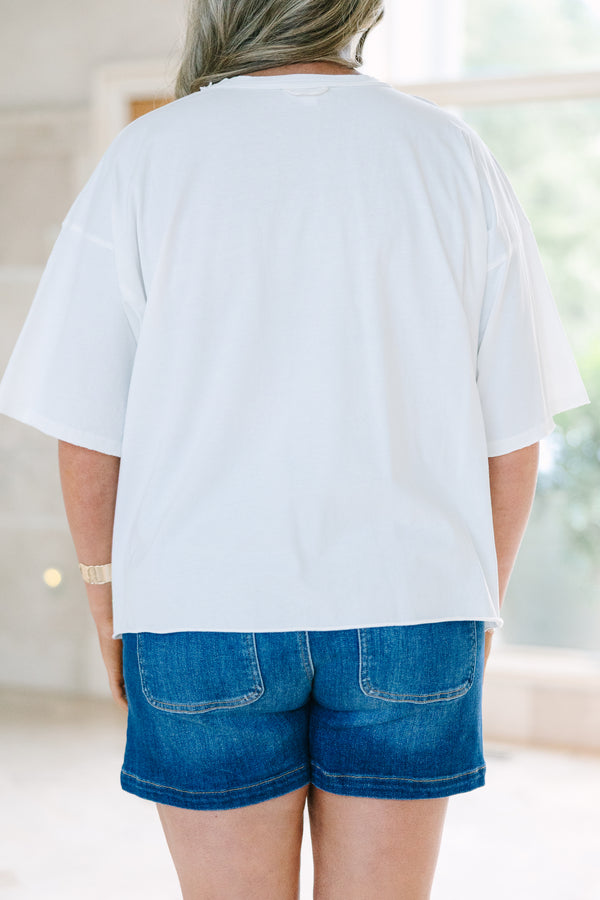 Plus Size white vintage wash tee with three colorful seashells and Amalfi text, paired with denim.
