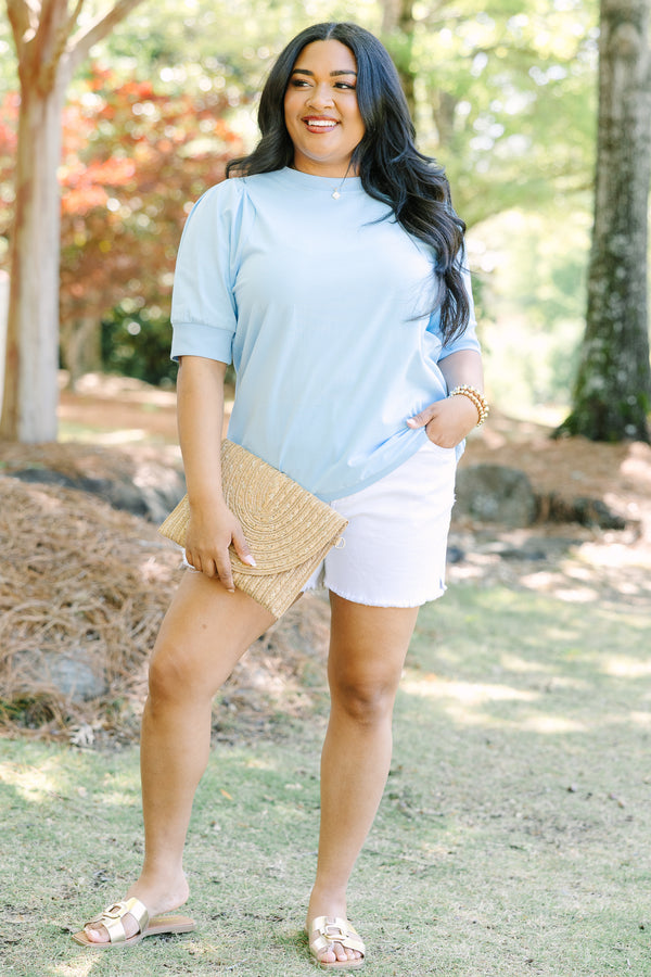 Plus Size light blue short sleeve top with puff sleeves and a crew neckline.