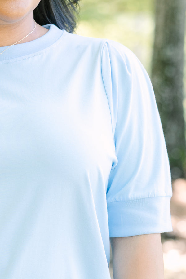 Plus Size light blue short sleeve top with puff sleeves and a crew neckline.