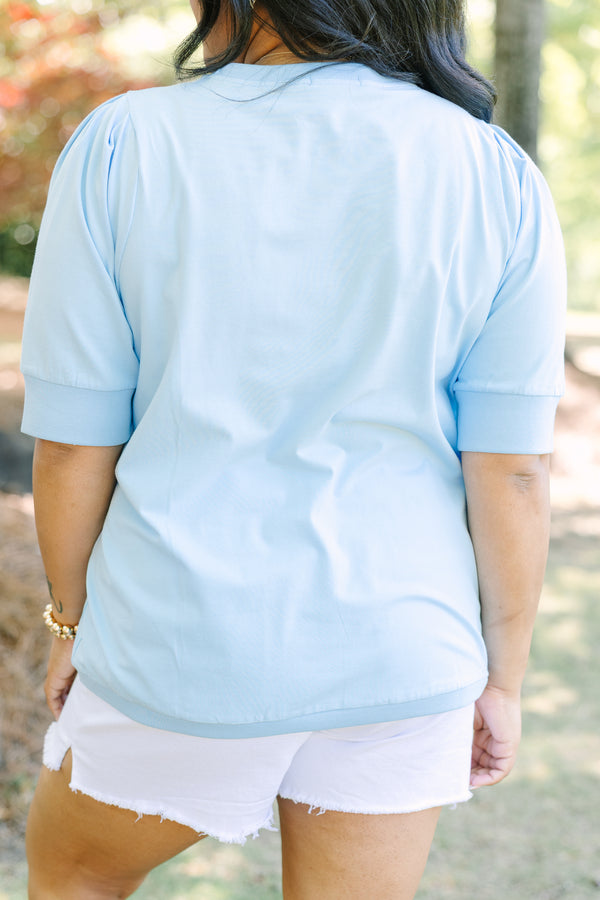 Plus Size light blue short sleeve top with puff sleeves and a crew neckline.