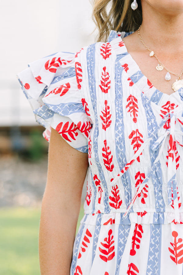 Plus Size midi dress with red leaf print, blue geometric stripes, flutter sleeves, and tiered skirt.