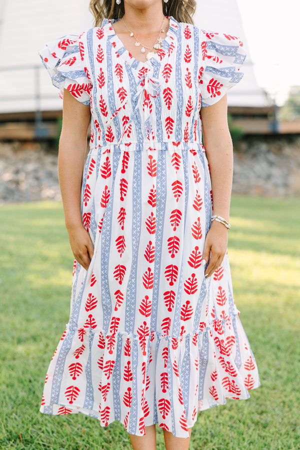 Plus Size midi dress with red leaf print, blue geometric stripes, flutter sleeves, and tiered skirt.