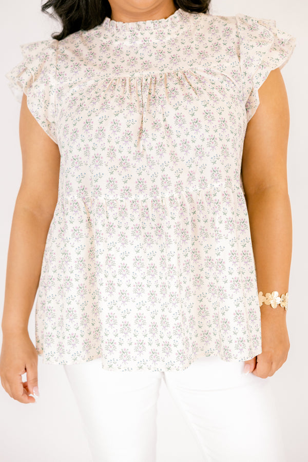 Chic Soul plus size clothing, cream top with flutter sleeves and a high neck that has ruffle detailing on the neckline of the top as well as a light floral pattern throughout the top 