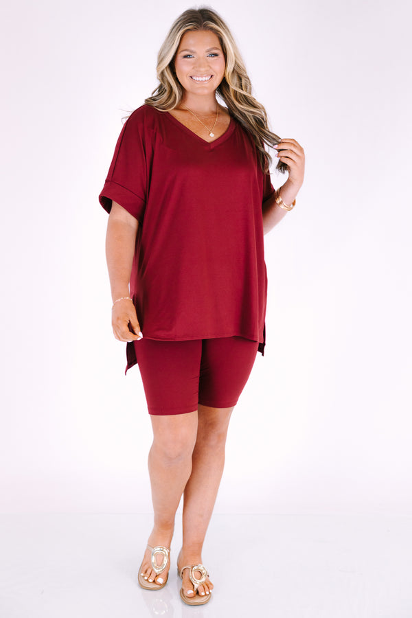 Plus Size cabernet two-piece set featuring a V-neck short sleeve tunic top and matching bike shorts.