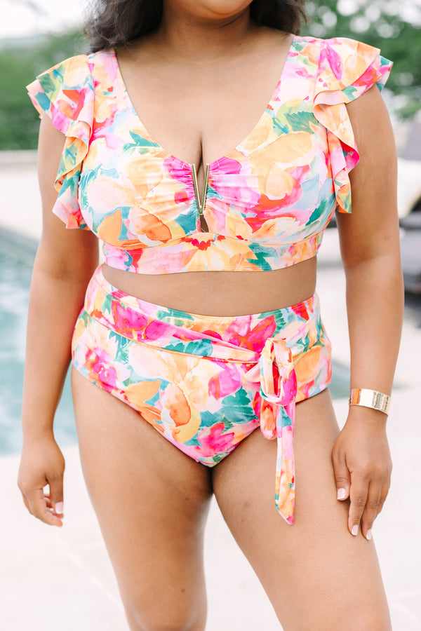 Chic Soul Plus Size Clothing, a pink, green, orange, and white water color floral print swim top with a gold V detail at center bust and ruffle sleeves