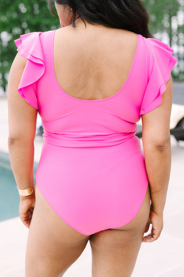 Chic Soul Plus Size Clothing, a pink swimsuit with a gold V detail at center bust, ruffle sleeves, and a bow belt detail