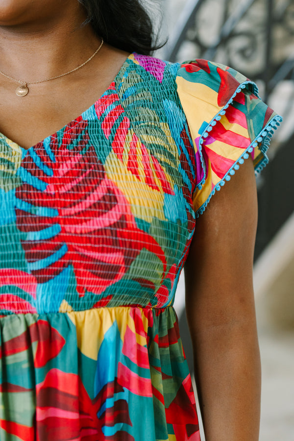 Plus Size pink tropical midi dress with a smocked bodice, flutter sleeves, and a tiered skirt.