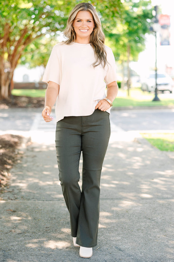 Plus size dark olive flare jeans in a stretchy rayon blend with a high-waisted, flattering fit.
