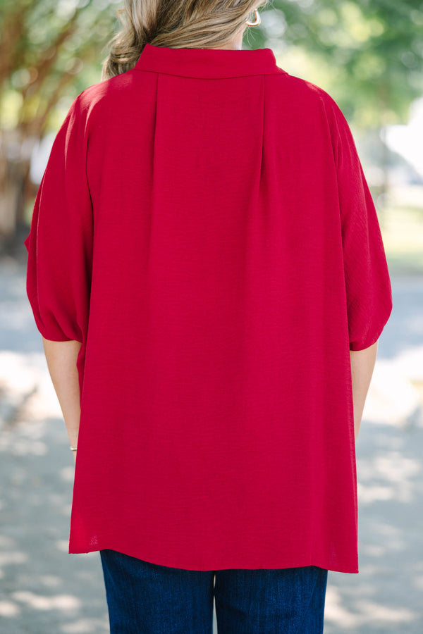 Plus size flowy wine red button-down top with a collared neck and drop shoulders.