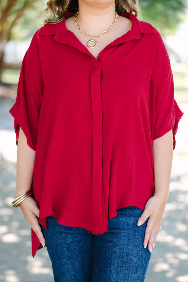 Plus size flowy wine red button-down top with a collared neck and drop shoulders.