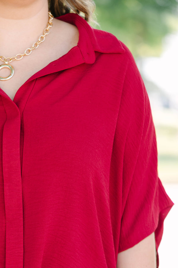 Plus size flowy wine red button-down top with a collared neck and drop shoulders.