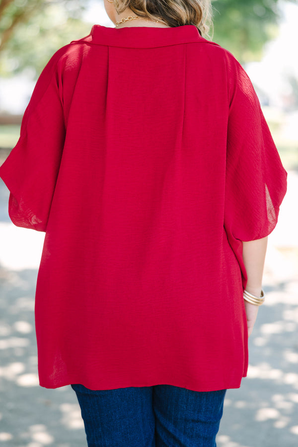 Plus size flowy wine red button-down top with a collared neck and drop shoulders.