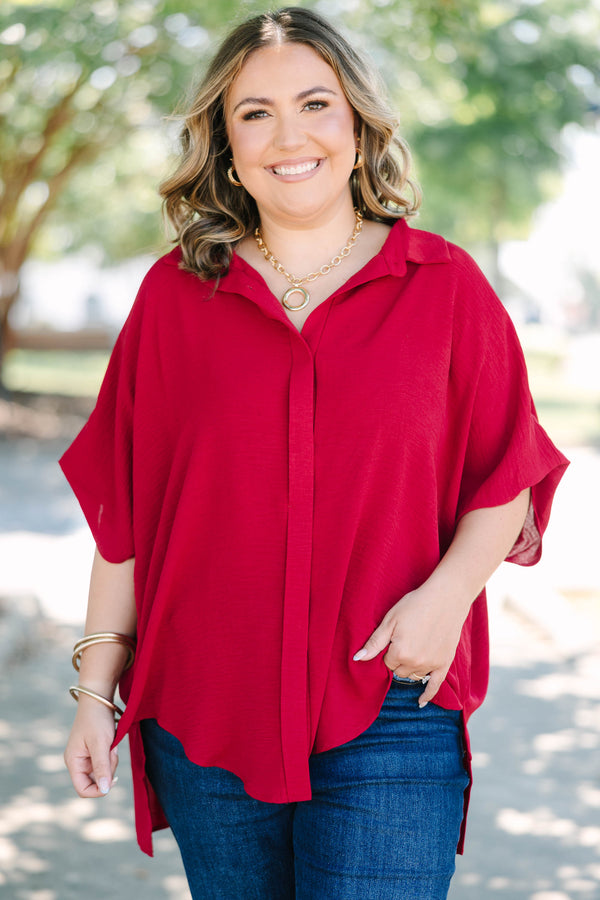 Plus size flowy wine red button-down top with a collared neck and drop shoulders.
