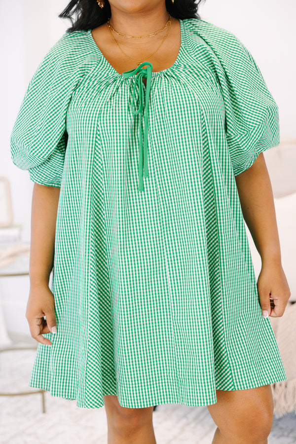 Plus Size kelly green and white gingham mini dress with puff sleeves and a tie-neckline.