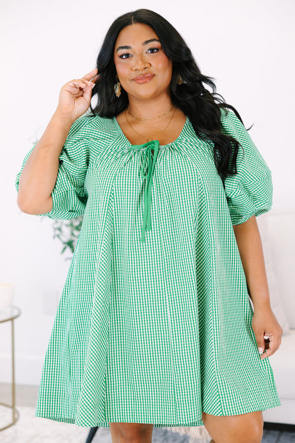 Plus Size kelly green and white gingham mini dress with puff sleeves and a tie-neckline.
