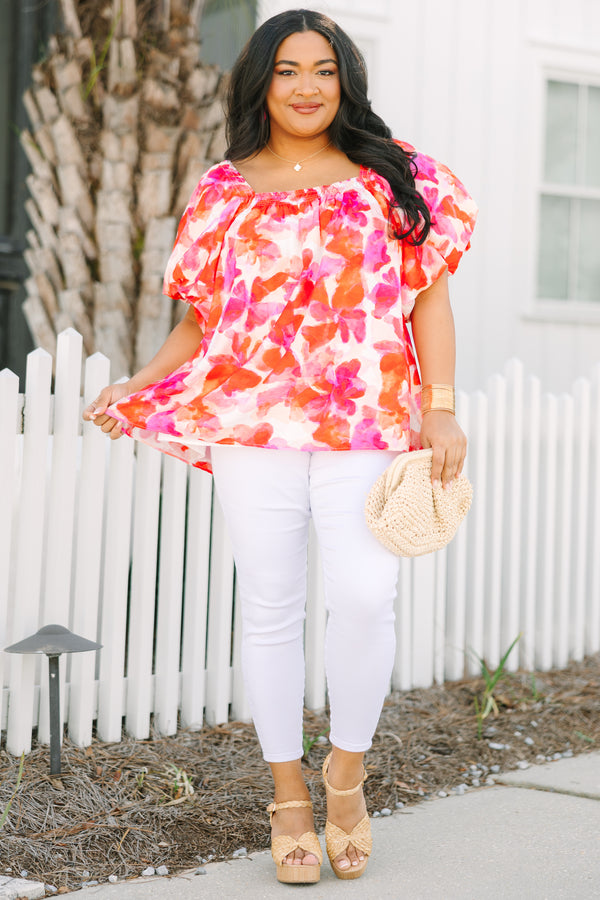 Chic Soul plus size clothing, white top with bubble sleeves a square neckline and a pink and orange and red watercolor floral pattern throughout