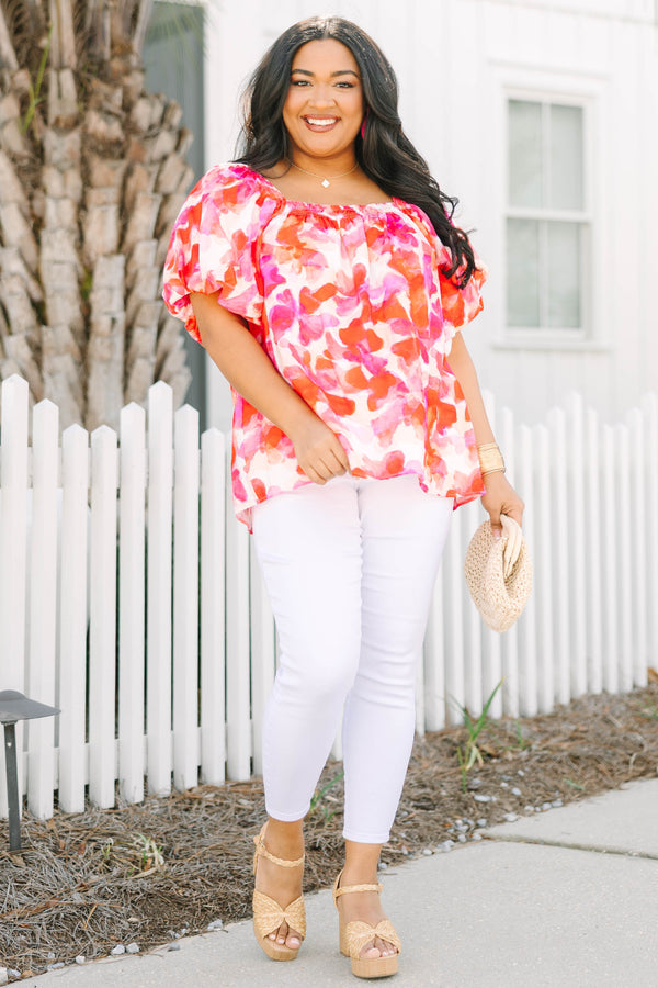 Chic Soul plus size clothing, white top with bubble sleeves a square neckline and a pink and orange and red watercolor floral pattern throughout