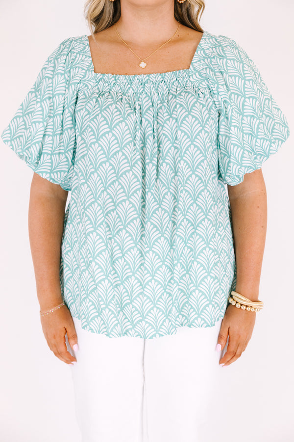 Chic Soul plus size clothing, turquoise baby doll top with bubble sleeves a square neckline and a floral block pattern throughout  
