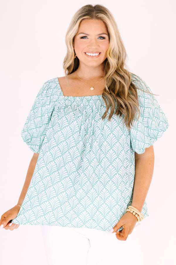 Chic Soul plus size clothing, turquoise baby doll top with bubble sleeves a square neckline and a floral block pattern throughout  