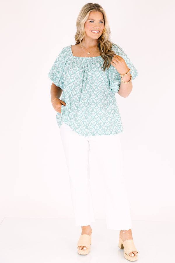 Chic Soul plus size clothing, turquoise baby doll top with bubble sleeves a square neckline and a floral block pattern throughout  