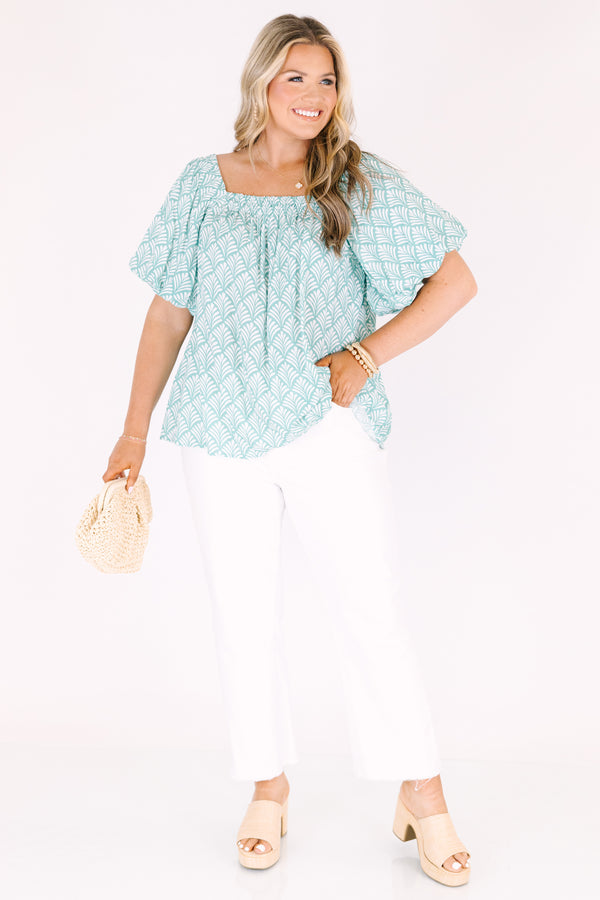 Chic Soul plus size clothing, turquoise baby doll top with bubble sleeves a square neckline and a floral block pattern throughout  