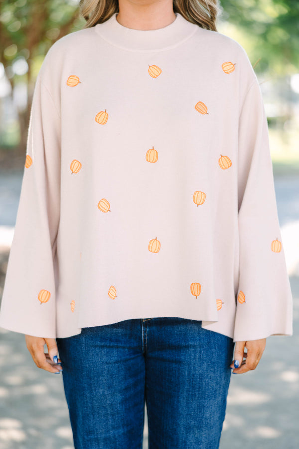 Plus size cozy taupe pumpkin sweater with a flowy fit and wide bell sleeves.