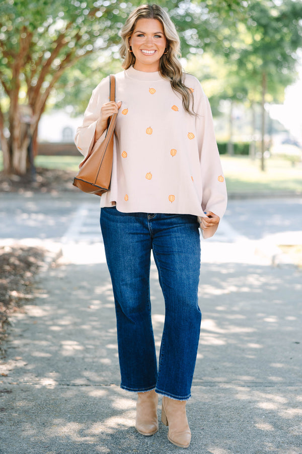 Plus size cozy taupe pumpkin sweater with a flowy fit and wide bell sleeves.
