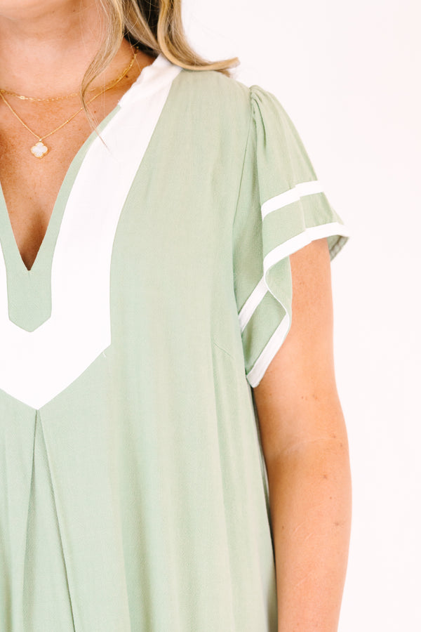 Chic Soul plus size clothing, sage maxi dress with white line designs outlining the bottom of the dress the end of the sleeves an a thick white strip outlining the v-neckline