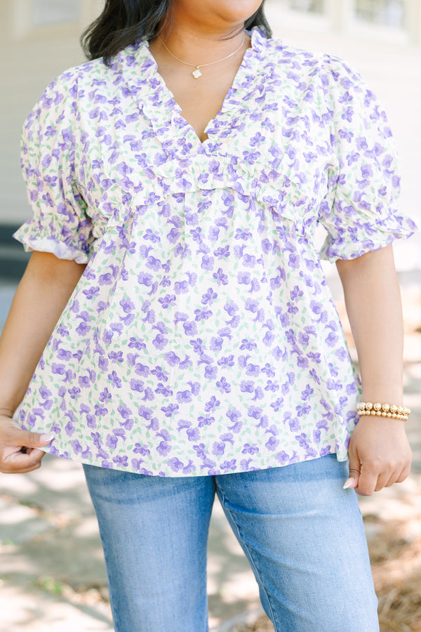 Plus Size purple floral print top with ruffled V-neckline and short puff sleeves.