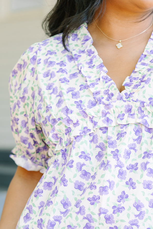 Plus Size purple floral print top with ruffled V-neckline and short puff sleeves.
