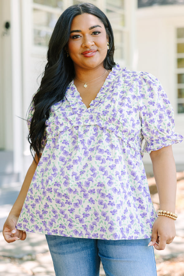Plus Size purple floral print top with ruffled V-neckline and short puff sleeves.