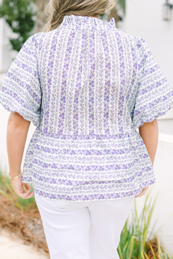 Chic Soul plus size clothing, purple top with short bubble sleeves and a floral leafy pattern throughout the top as well as purple  textured fabric going down the both sides of the chest and under the bust area 