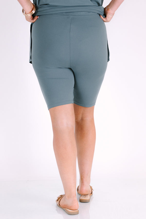 Plus Size ash jade short set with a round neck, high-low hem top and matching biker shorts.